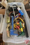 Plastic tub with lid, jumper cables, ratchet strap, torch, string, extension cord, garbage bags