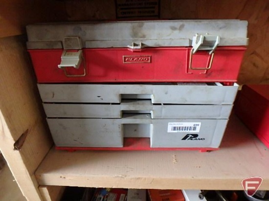 Plano toolbox with contents: electrical tape, pop rivets, spark plugs,