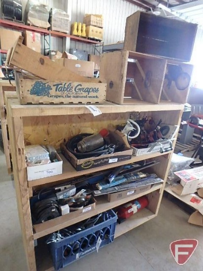 Contents of 4 shelves: wood crates, lock nut assortment, tarp straps, rake teeth,