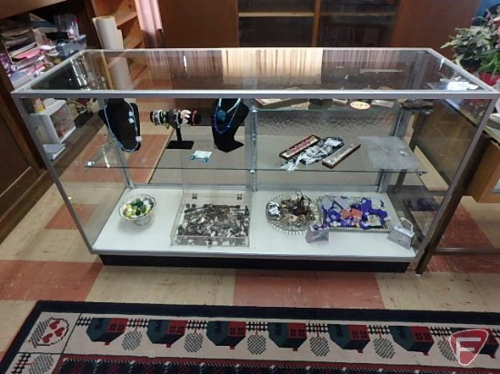 Glass display case, three adjustable glass shelves, two back sliding doors, locking with key