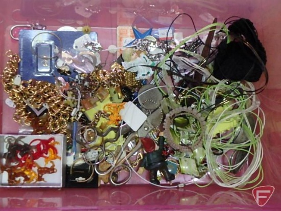 Sunglasses, pens, hair accessories, watches, bracelets, jewelry items, and display containers