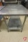 Stainless steel table with shelf and adjustable legs, 48inx30inx35-1/2in