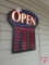 Lighted 'Open Business Hour' sign, lists hours Monday through Friday