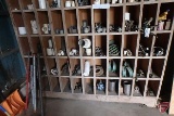 Contents of cabinet: pipe fittings, hardware, PVC fittings