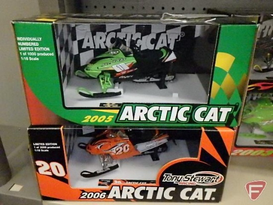 Replica toy snowmobiles, Arctic Cat 2005 limited edition and 2006 Tony Stewart Racing limited ed,