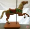 Wood carousel horse mounted on pole on wood platform with wheels, 66inHx25inWx68inD