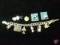 Sterling Silver charm bracelet with 9 Sterling Silver charms: