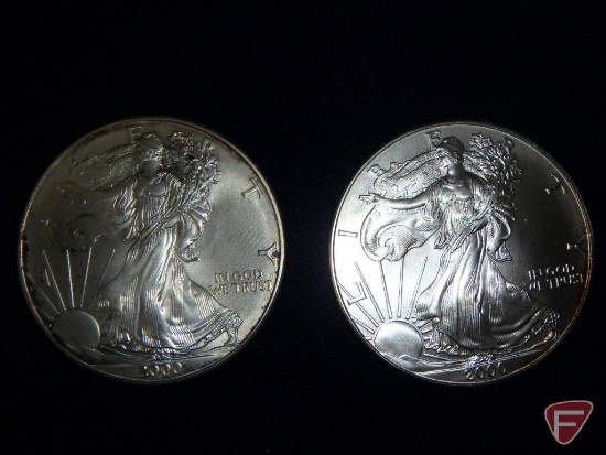 2 Uncirculated 2000 US Silver Eagles 1 ounce .999 Silver, 1 is slightly dirty