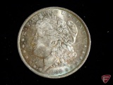 1888 O Morgan Silver Dollar uncirculated with heavy scratches on face, nice toning