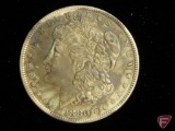 1880 O Morgan Silver Dollar AU or better, heavy dark toning on obverse and reverse