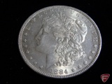 1884 Morgan Silver Dollar Choice Unc., heavy toning on obverse less on reverse