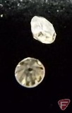 2 round Diamond melee stones, .01 PT ea.