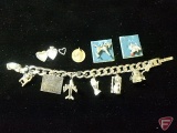 Sterling Silver charm bracelet with 9 Sterling Silver charms: