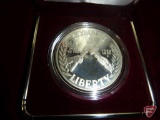 1988 Olympic Proof Silver Dollar in original packaging with certificate of authenticity