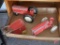 Vintage red toys; tractors, disc, wagons, metal toy cart and cabinet