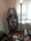 Wood wall shelf with quilt bar 48in, afghan, floor lamp, and positional wood oval standing mirror