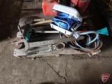 Large wrenches, pry bars, jumper cables, window scraper, axes