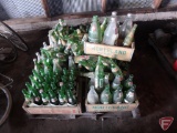 Glass pop bottles and wood crates: 7up, Mountain Dew, RC Royal Crown Cola, Pepsi