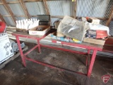 Work bench and contents: inner tubes, DLX fuel line de-icer, compass, tool box,