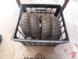 (4) pneumatic tires and milk crate