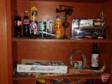 Contents of two shelves: Model cars, pennants, patches, True Value Dodge Iroc 1:24 die cast model,