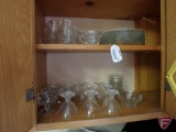 Contents of cupboard: clear glassware, plates, cups, bowls, dessert cups
