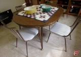 Table with metal legs and Formica top with one leaf, and (4) matching metal framed chairs