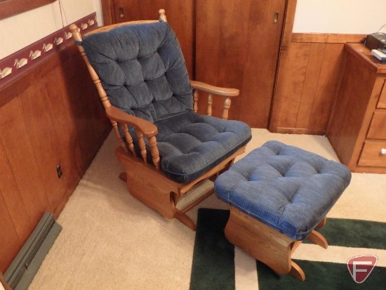 Wood glider with matching gliding ottoman, upholstered cushions, and matching throw