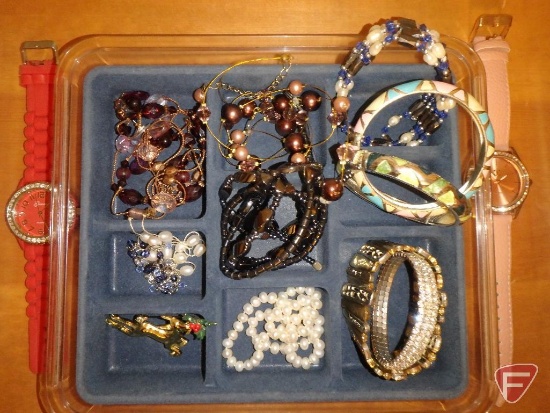 Jewelry in containers/box, pins, necklaces, bracelets, earrings and watches. All jewelry on shelf