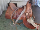 Western saddle, 15in seat, with girth and breast collar and metal stool.