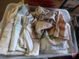 Tote of feed sacks, some completely opened, and dropcloths