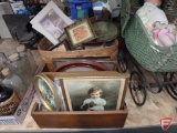 Basket and wood magazine rack with assortment of frames and prints, some vintage.