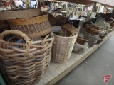 Large assortment of wicker baskets and containers, various styles and sizes.