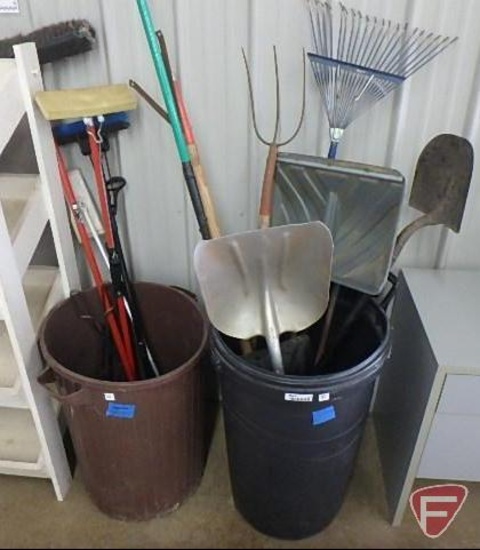 (2) plastic cans, one with lid, with shovels, rake, apple picker, mops, broom, wood tongs, Both
