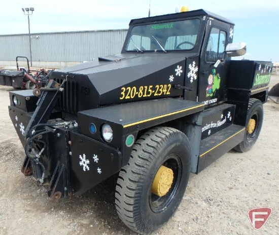 Aircraft Towing Tractor/Tug modified to plow snow