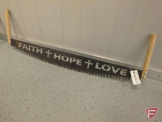 2-man saw with "Faith, Hope, & Love" cut out