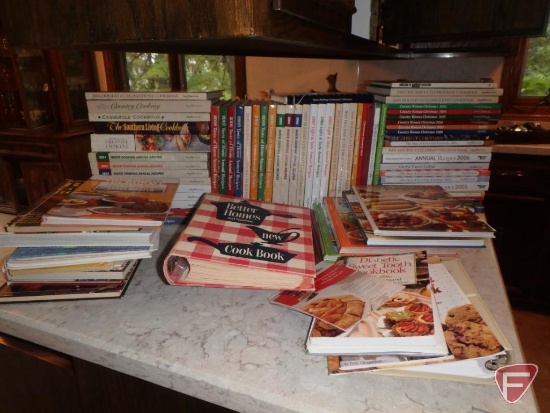 Large assortment of cookbooks.