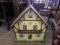 Child wood items, doll house, ironing board, (2) chairs, and chalkboard easel. 5 pieces