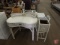 White wicker desk with 2 drawers and built in lamp, and wicker planter. Both