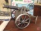 Metal replica cannon, cast iron muffin tin, and (3) books, Norman Rockwells World War II,