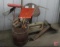 Metal tractor seats, washer wringer, net, shovels, dust pans, saws. Contents of wood barrell plus