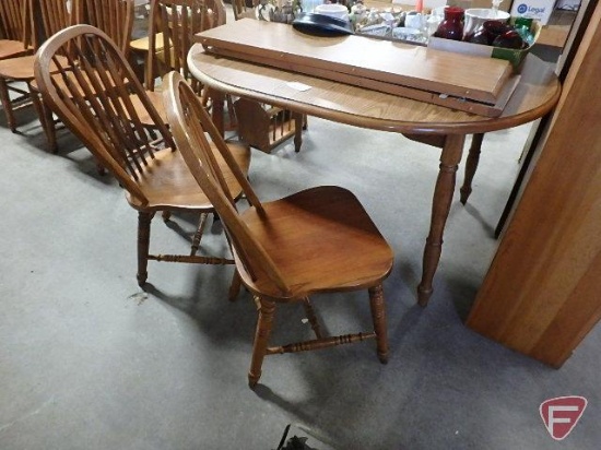 Wood table 53inL with (2) 12in leaves. (6) matching chairs.