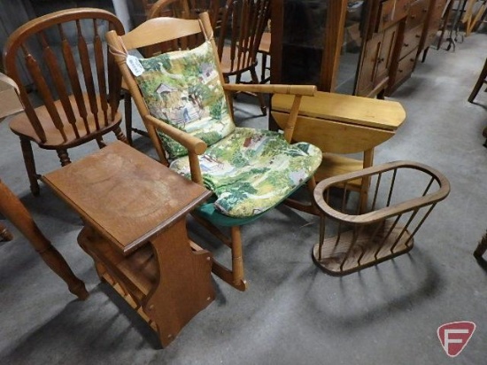 Wood rocking chair with upholstered cushions.