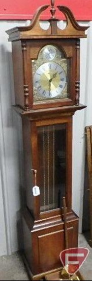 Howard Miller Tempus Fugit grandfather clock. Weights and pendulum included. 76InH
