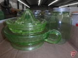 Green depression glass shakers, juicers, Jadeite shaker pair, and clear glass shakers. Contents of 2