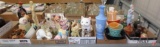 Figurines, bells, planters, candle holders, vases, perfume decanters, cat pitcher.