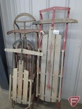 (3) wood and metal sleds, longest is 56inL. 3 pieces