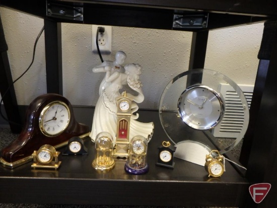 LaVie porcelain figurine, Danbury table clock, mantle clock 8inw, and miniature clocks. 10 pieces