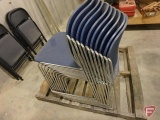 Stack of blue chairs, metal legs