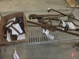 Contents of shelf: old hand tools including bale hook, wrenches, tapping bar, brace drill